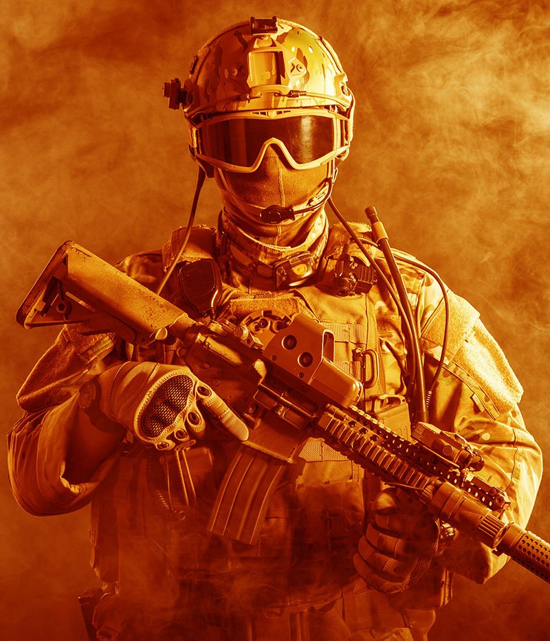 Special forces soldier with rifle in the fire